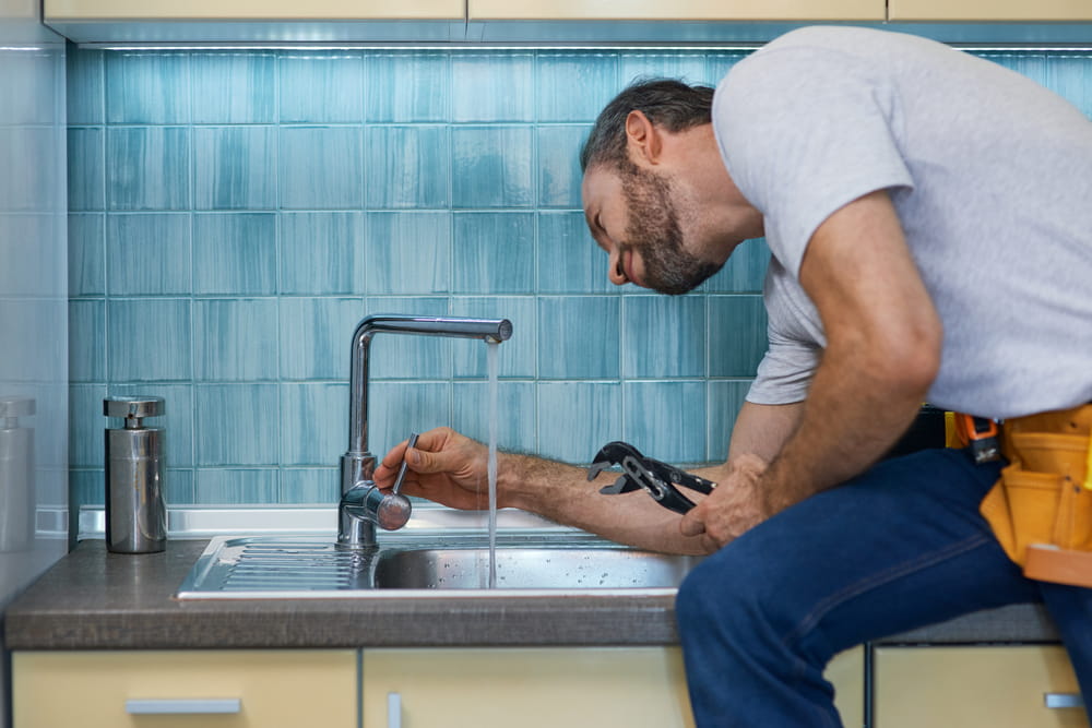 Professional Plumber Looking Concentrated