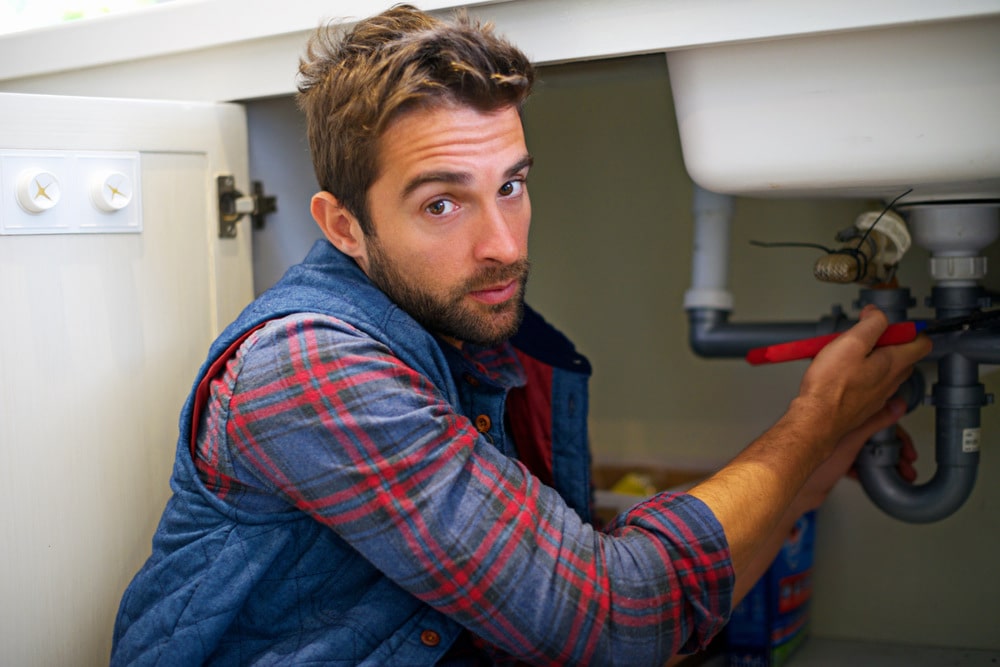 plumber in grand prairie repairing sink