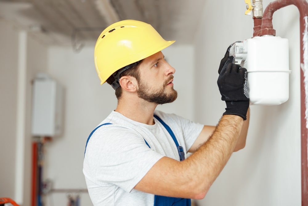 professional checking gas meter