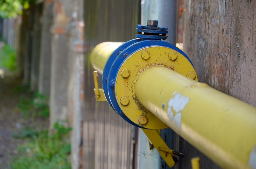 Yellow Gas Pipe in Front of Residential Building