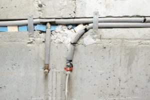 Pipe for supplying water on concrete wall