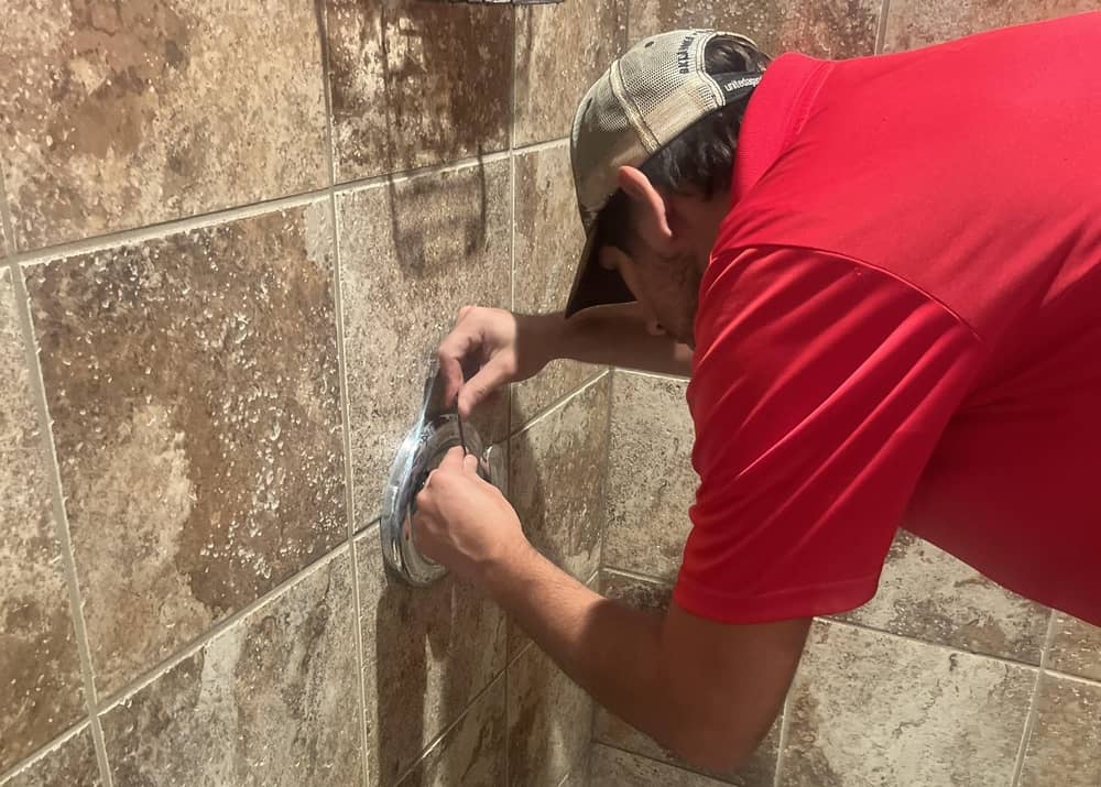 Emergency Plumber working in bathroom